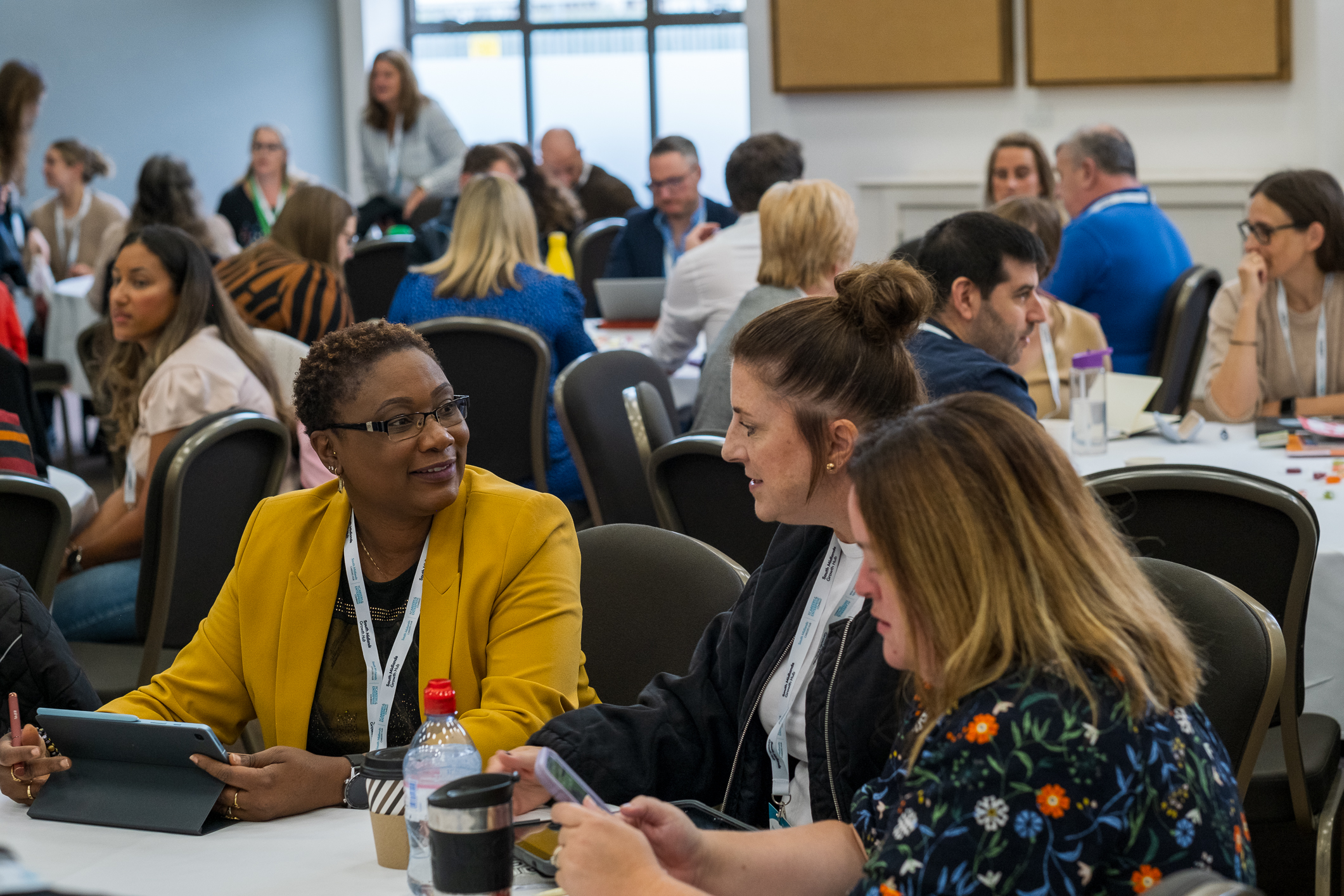 Careers staff in discussion at a round table as part of a regional meeting